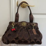 Brown Optic Signature Coach Garnett Turnlock Bag