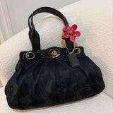 Black Optic Signature Coach Garnett Turnlock Bag