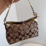 Legacy Turnlock Coach Signature Gold Mini Bag
